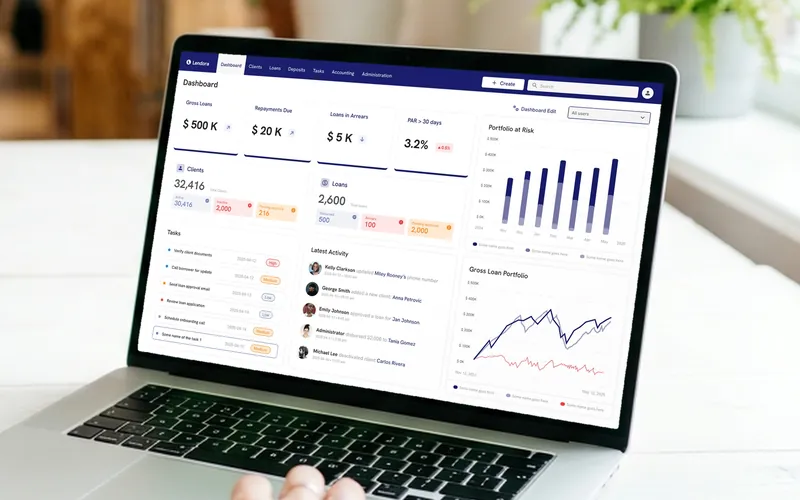 Lendora lending dashboard on a laptop in an office